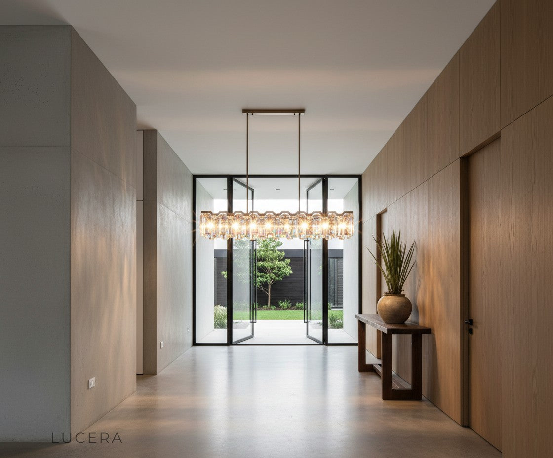 Moody ambient lifestyle shot of crystal chandelier glowing in a dark, elegant interior