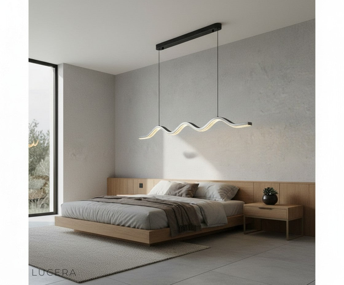 nighttime lifestyle shot of pearl black wave chandelier in elegant lounge with moody lighting