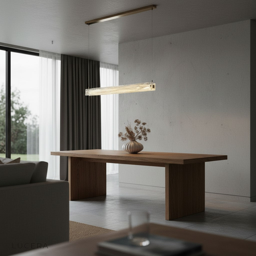 modern chandelier over breakfast nook with natural daylight and neutral decor