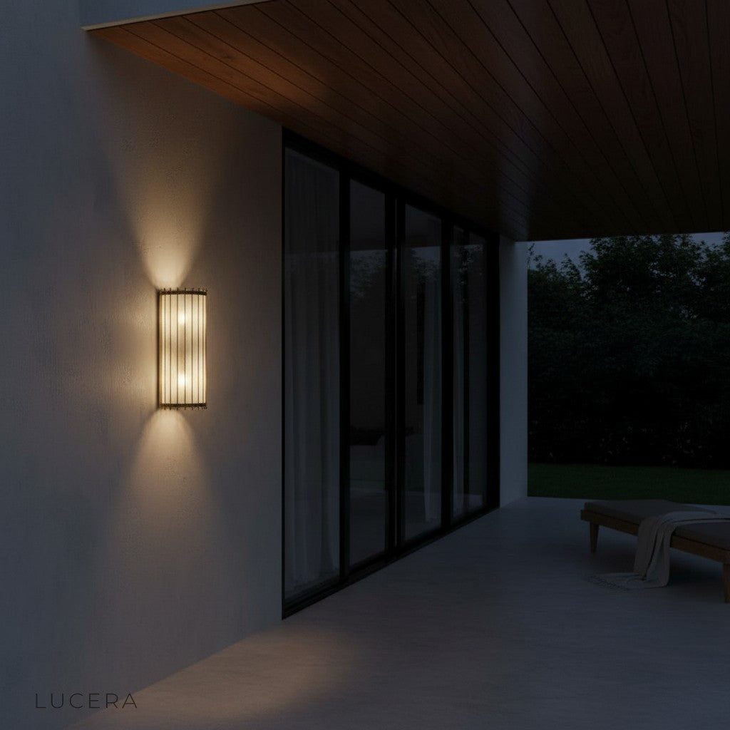 Vault glass wall lamp in stylish dining room with warm evening ambiance