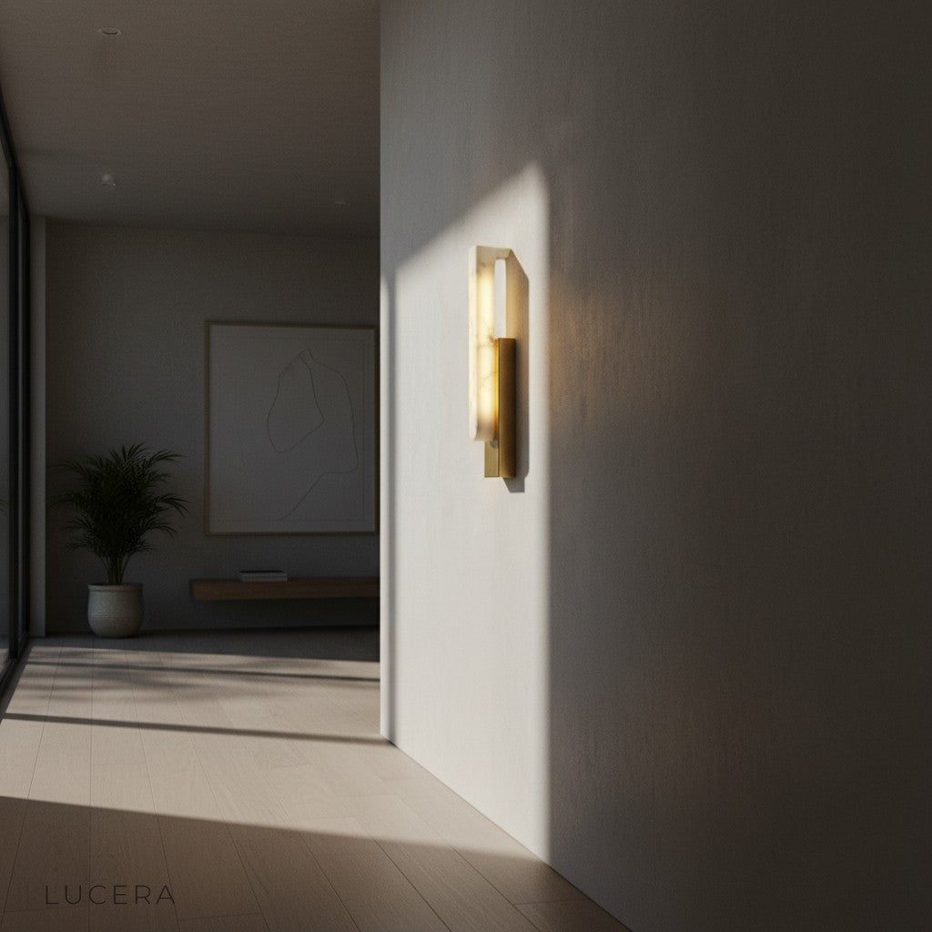 Modern marble sconce in bathroom vanity area with warm spa-like glow