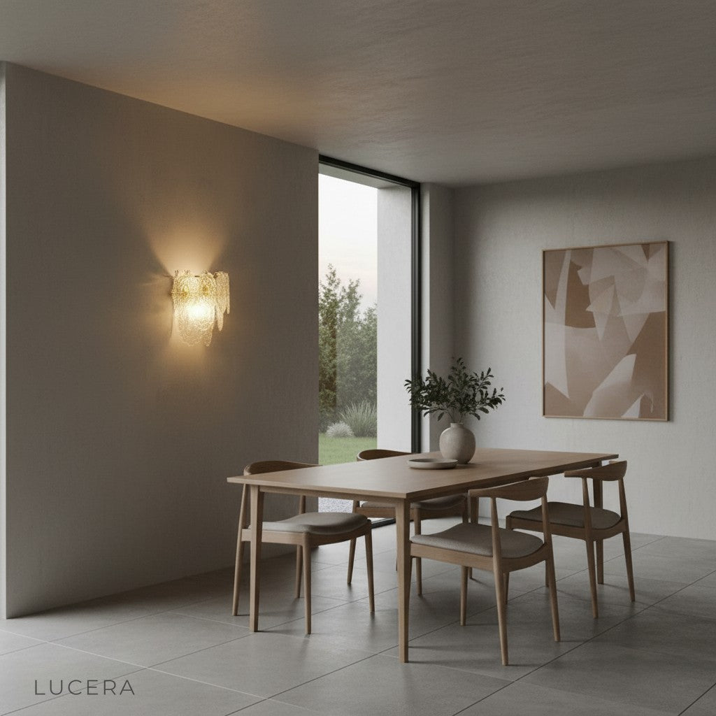 elegant French wall lamp lit in warm tone beside upholstered armchair