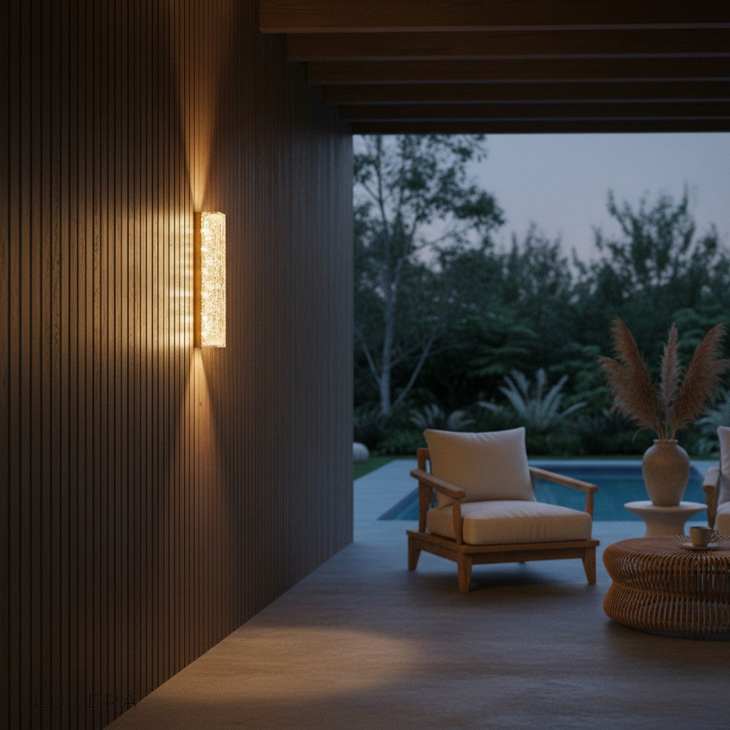 Opera Crystal Wall Lamp glowing in outdoor covered balcony setting at twilight with elegant ambiance