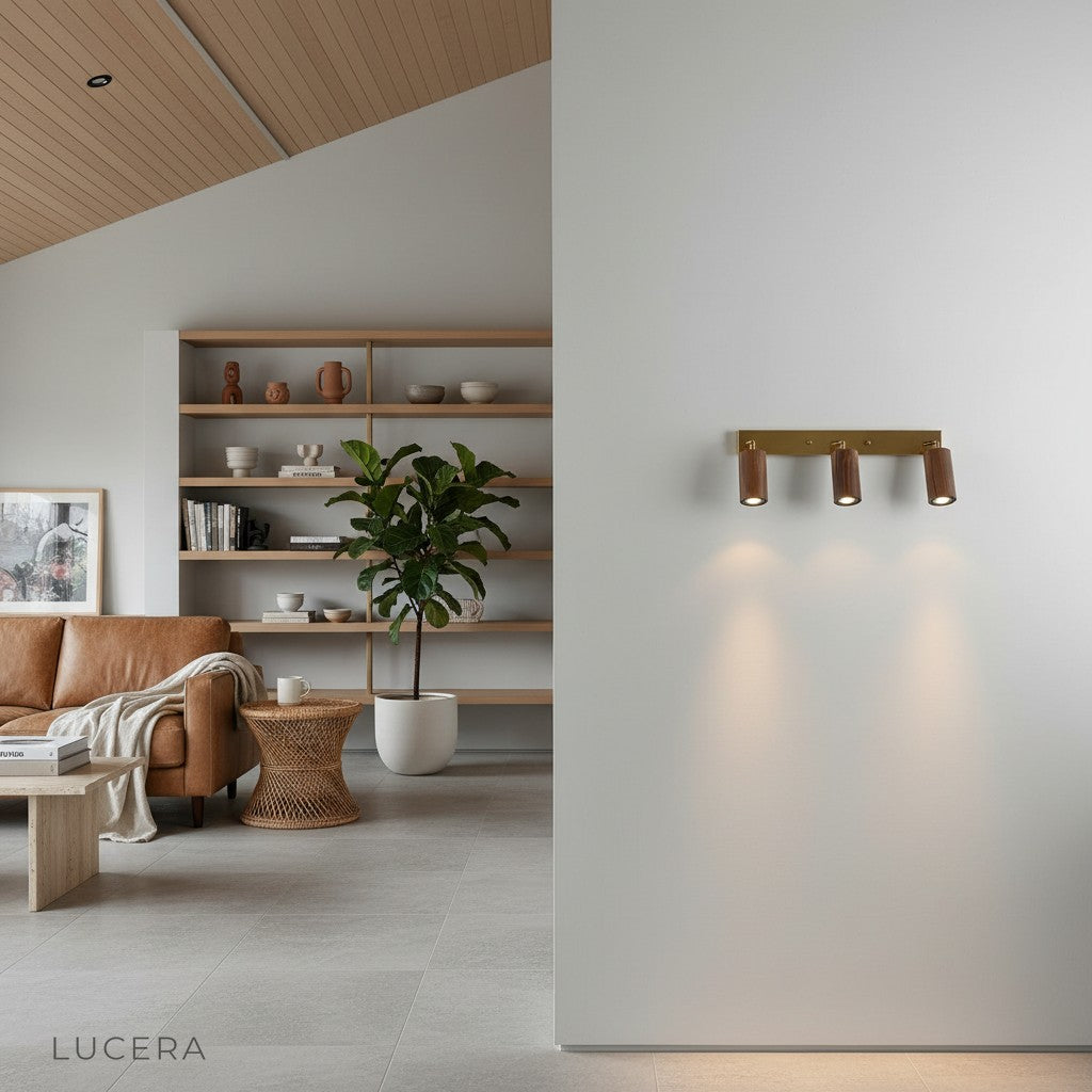 ambient evening shot of Saltando LED sconce highlighting a textured wall panel