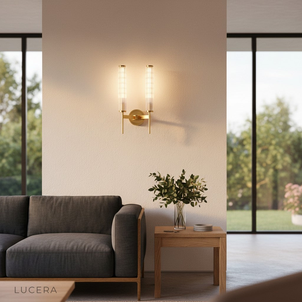Sul wall sconce casting warm light in a contemporary dining space at night