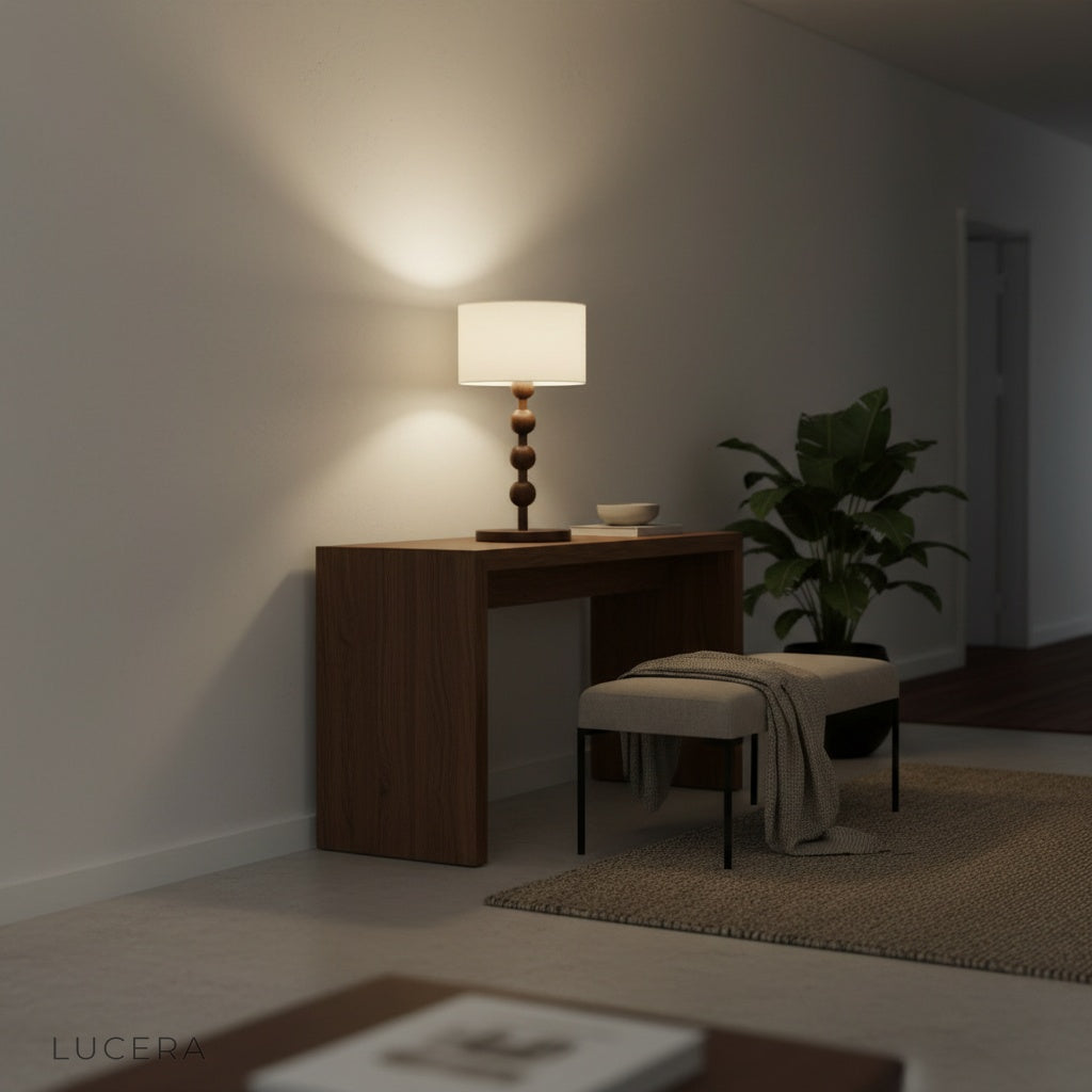 architectural accent Boreal Table Lamp beside armchair in minimalist interior with warm evening lighting