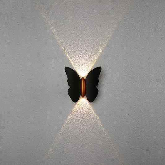 minimalist studio view of black butterfly sconce light