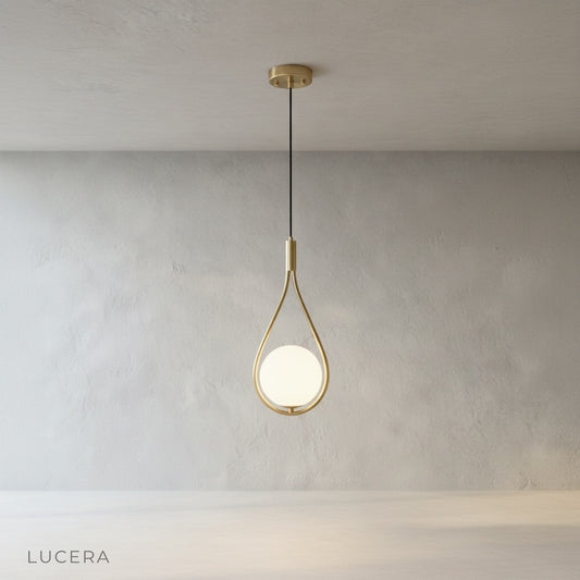 minimalist copper pendant light with glass shade on clean studio background