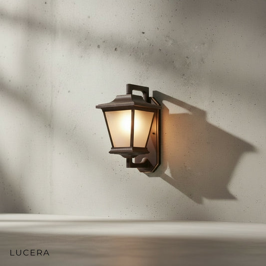 Front view of Ophelia Outdoor Sconce mounted on a neutral wall, showing clean industrial lines