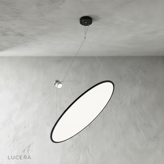 studio shot of black metal disc pendant light with white diffuser from front angle
