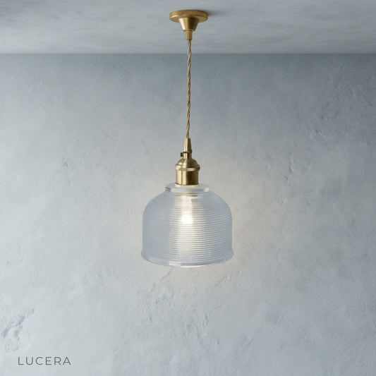 front view of Lucera Harmony Pendant Light with adjustable wire and LED bulb in studio lighting