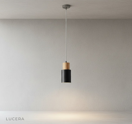 Minimalist wood and metal pendant light on a clean white studio background