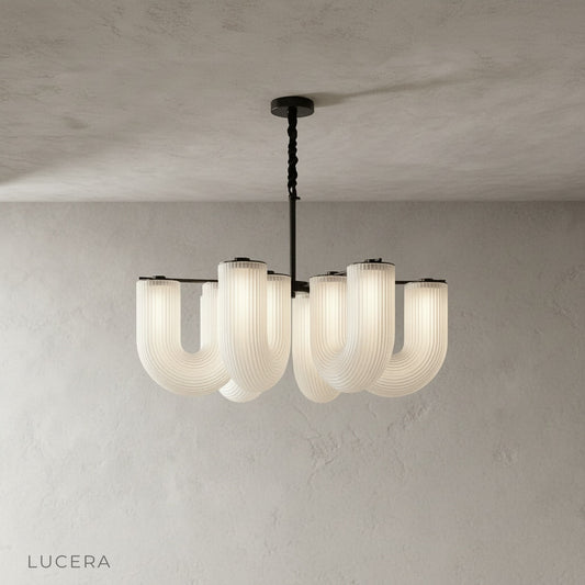 front view of Thalassa chandelier in gold with eight spherical acrylic lights on metal frame