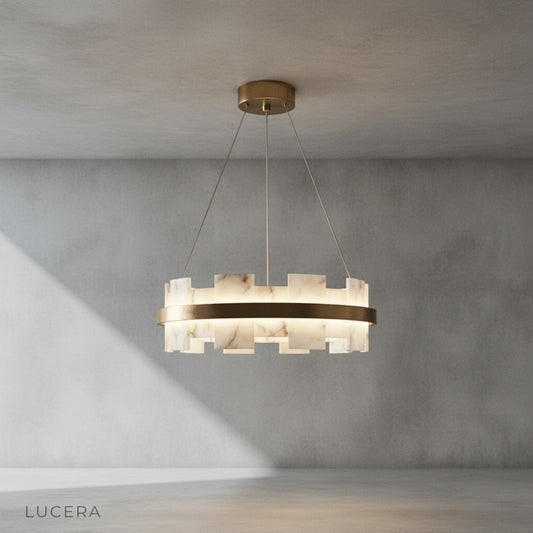 front view of Ablution chandelier showing brushed copper frame and floating circular silhouette on clean background