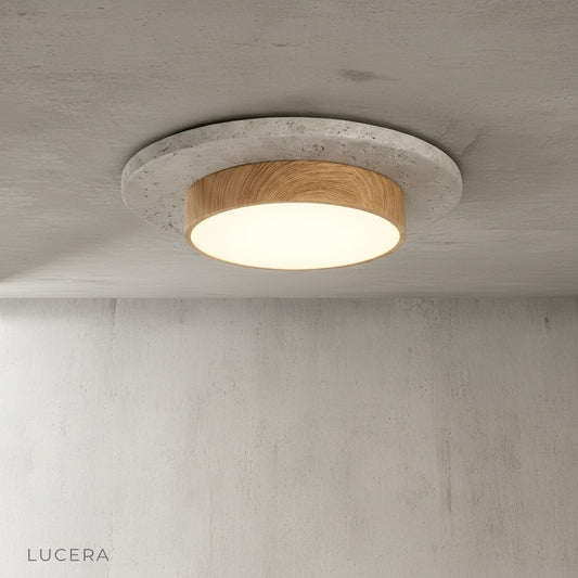 Studio shot of round travertine ceiling light with brushed nickel ring on neutral background