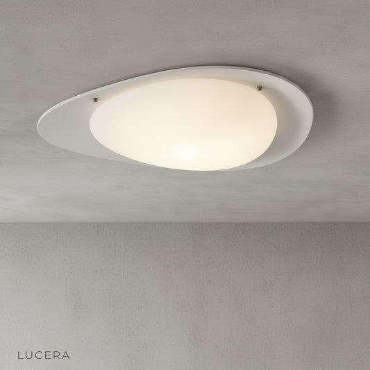 studio shot of white Saturn flush mount ceiling light on clean neutral background