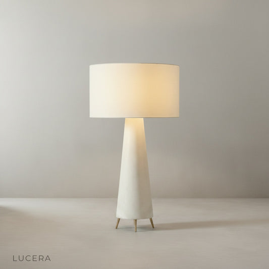 Studio shot of Quarters Floor Lamp front view with soft fabric shade and rounded base on clean neutral background
