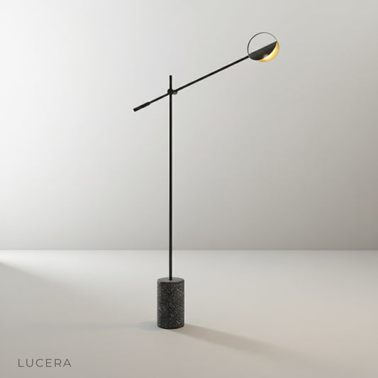 Studio shot of Memento Floor Lamp front view on clean white background showing slender iron arm