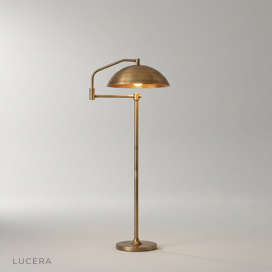 studio shot of Caledon floor lamp with wide dome shade and extended arm