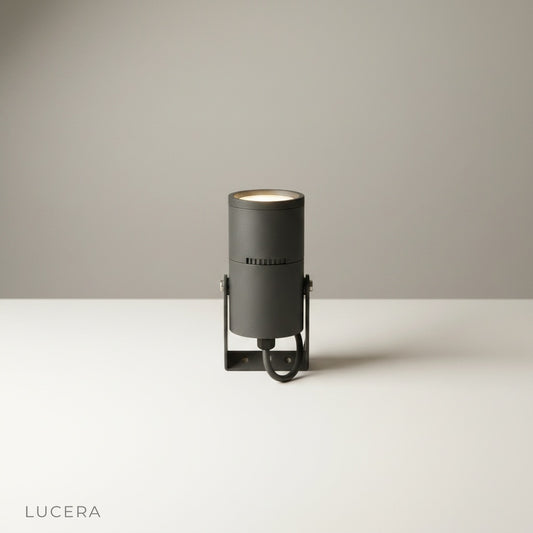 studio shot of cylindrical aluminum outdoor spotlight on clean white background