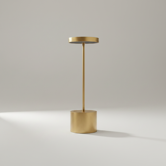 studio shot of minimalist aluminum Sinkhole Table Lamp on neutral background