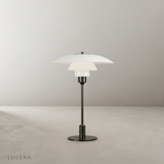 studio shot of baccarat table lamp with green shade and frosted glass diffuser