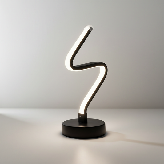 studio shot of Zephyrine table lamp with curved aluminum and iron base