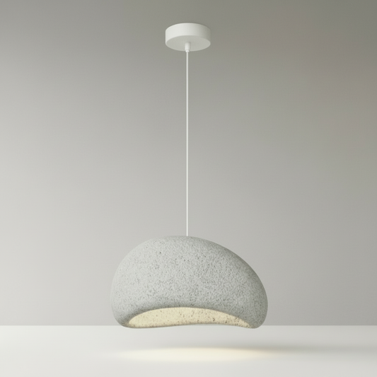 studio shot of suite sand pendant light on neutral beige background