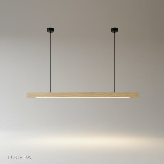 studio shot of Kirsch pendant light with linear wood body and rounded polycarbonate diffuser