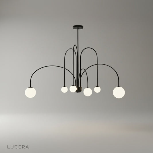 Studio shot of Unico Chandelier with arched iron frame and opal glass globes