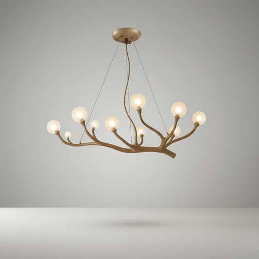 studio shot of Xavier chandelier with sculptural branch arms and clear glass globes on white background