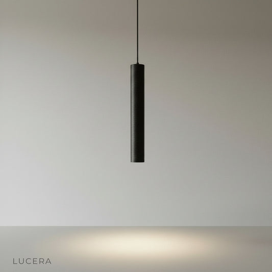 minimalist cylindrical concrete pendant light on clean studio background