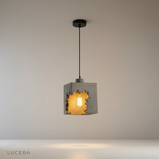 Studio shot of Enthrall concrete pendant light with geometric cutouts on clean white background