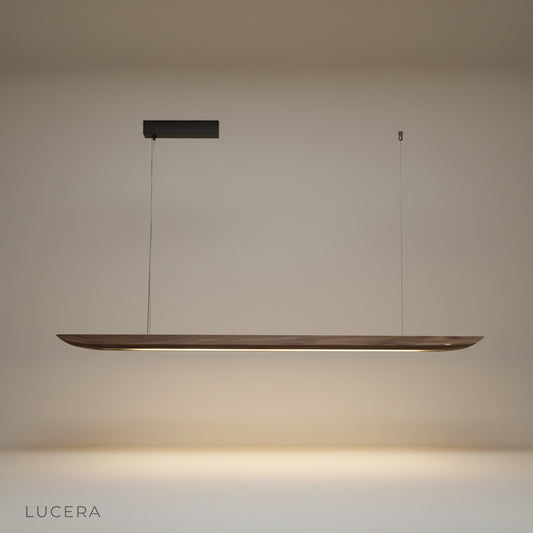 Studio shot of the Fauvist pendant light showing its elongated wooden form against a clean white background