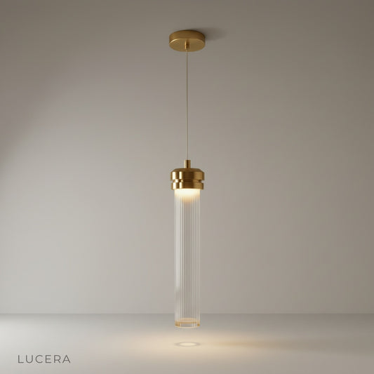 Studio shot of Palace Pendant Light with long fluted glass shade and metallic gold finish on clean white background
