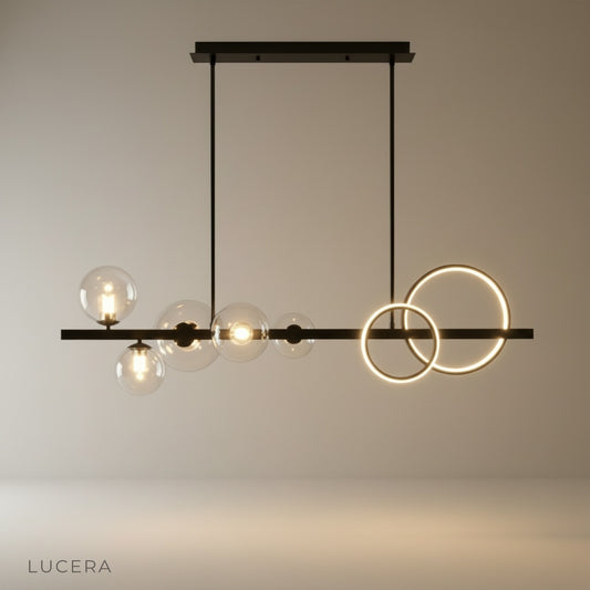 black and gold linear pendant light with three glass bulbs on clean studio backdrop