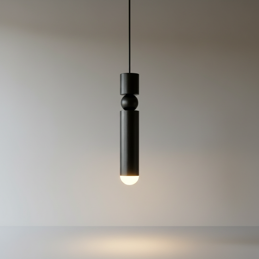 Studio shot of Wane pendant light with three cylindrical iron and acrylic shades at varying heights