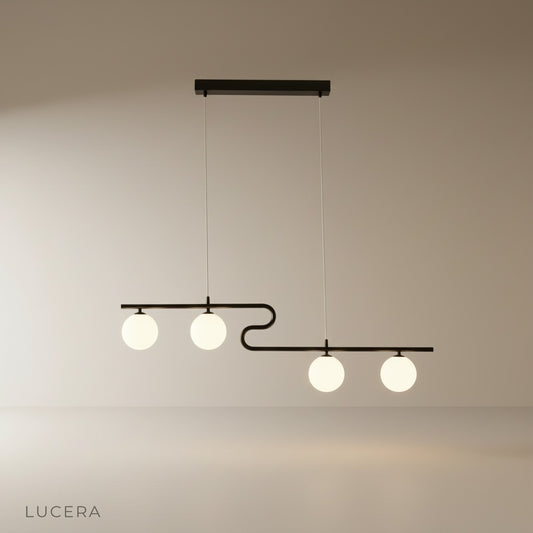 studio shot of gold-finished Quest pendant light against clean white background