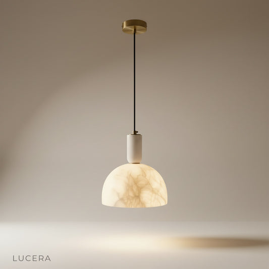studio shot of Midas pendant light with metal frame and alabaster shade on clean white background