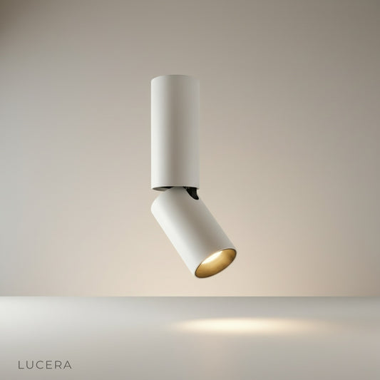 studio shot of Bewitch ceiling light with matte aluminum finish and three adjustable cylindrical heads