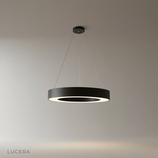studio shot of round LED pendant light with metal and acrylic frame