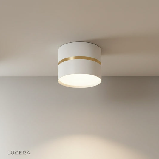 studio shot of die-cast aluminum downlight in white finish on clean neutral background