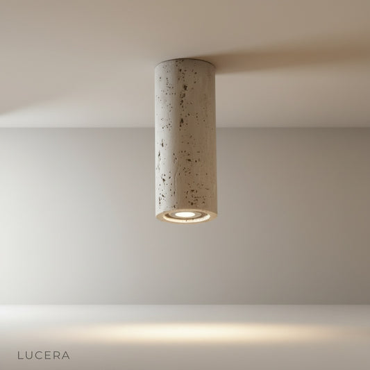 Kymation downlight studio view on clean white background showing travertine cylinder