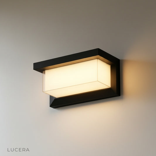 minimalist die-cast aluminum wall lamp front view on clean white studio background