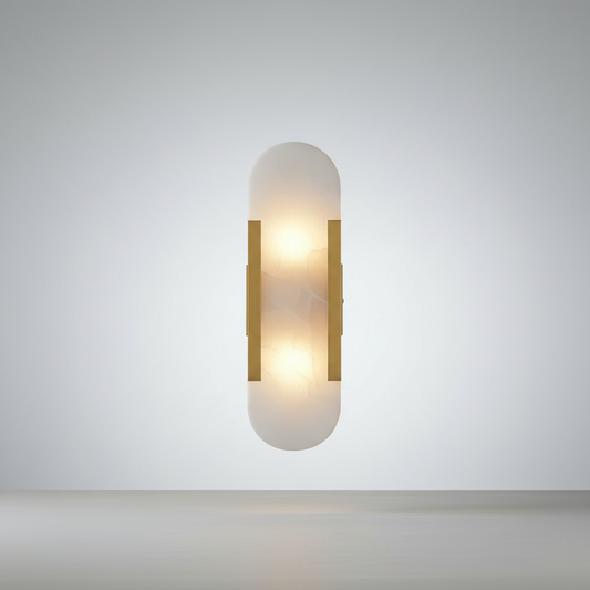Studio shot of Nettle wall lamp with gold frame and white marble shade on neutral background