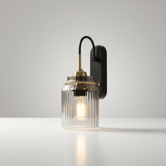 studio shot of Festa wall lamp with curved metal arm and ribbed glass shade on clean white background