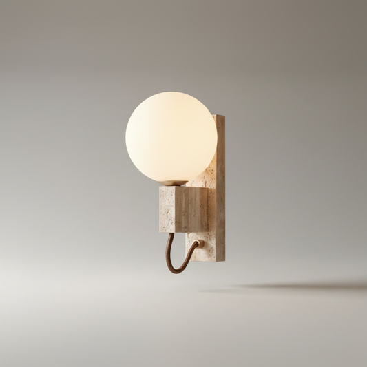 studio shot of Sole wall sconce with natural travertine sphere and metal arm