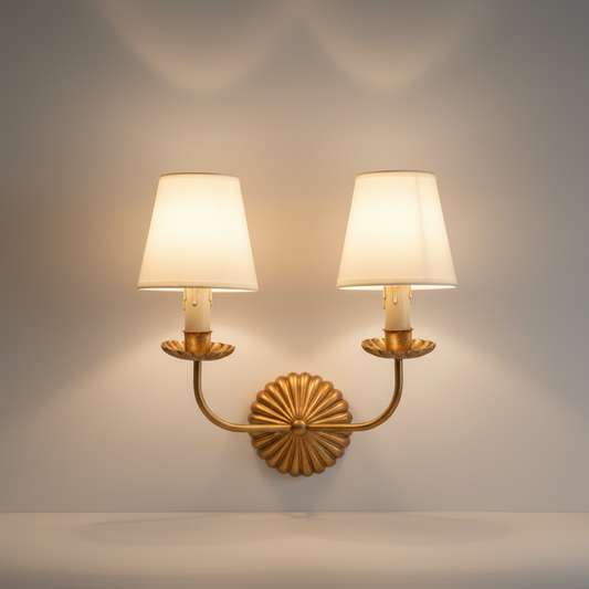 studio shot of vintage iron wall lamp with fabric shade and faux candle sleeves