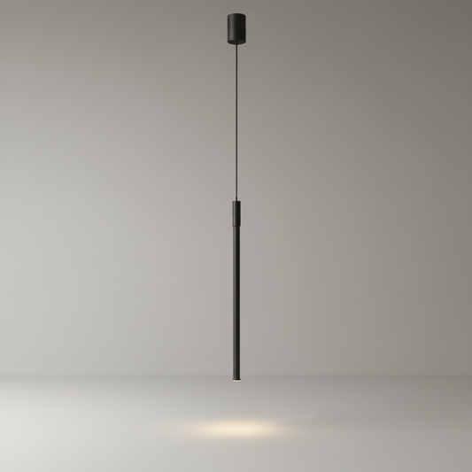studio shot of a black linear pendant light with integrated LED bar