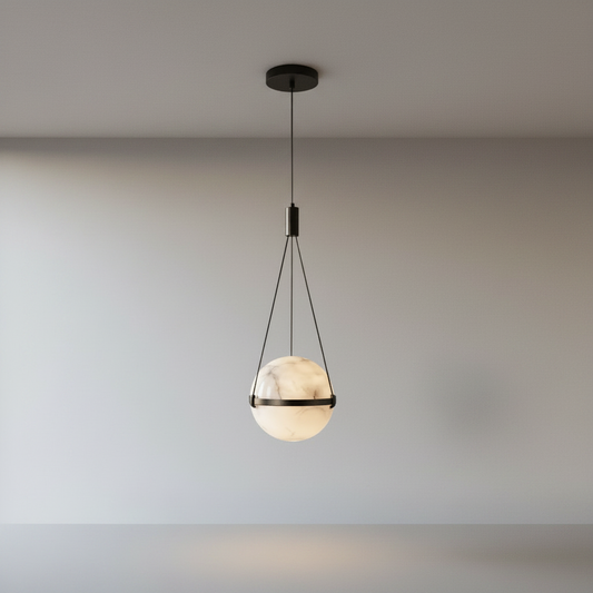 Seraphine Pendant Light black copper frame and alabaster marble globe on clean studio background